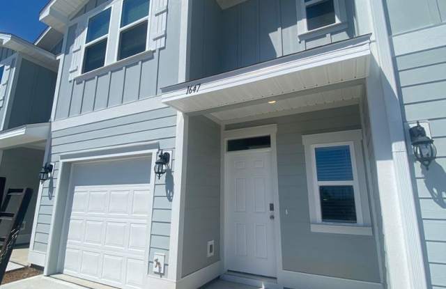 Modern, Spacious & Efficient Townhome in Lynn Haven! *1/2 OFF Security Deposit for Active-Duty Military!* photos photos
