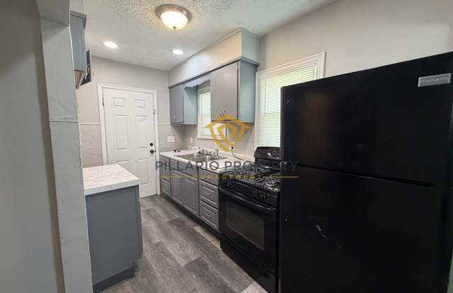 Charming 3-Bedroom Stone Bungalow with 2-Car Detached Garage & Fenced Yard, Available NOW! Gallery 4