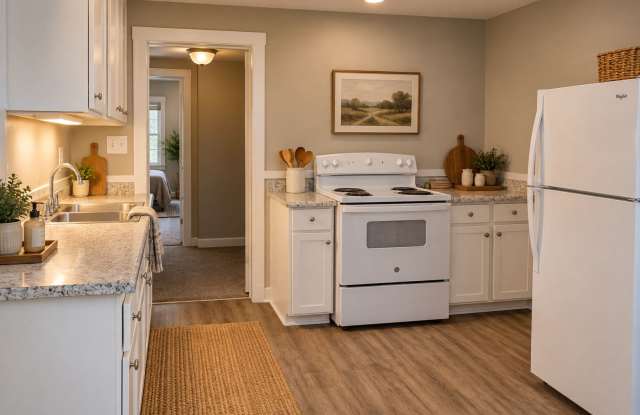 2015 E 16th St - Spacious 4BR Home with Charming Front Porch & Private Fenced Yard Gallery 1
