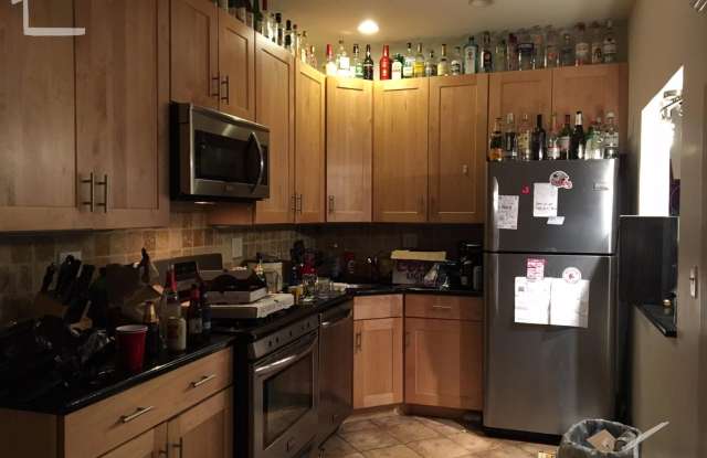 Nicely renovated 4 bed unit near the Green Line in a heavily sought after location! photos photos