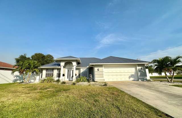 Stunning 3 Bedroom + Den Home with Fence + Screened Lanai in Great Location! - 301 Northeast 23rd Avenue, Cape Coral, FL 33909