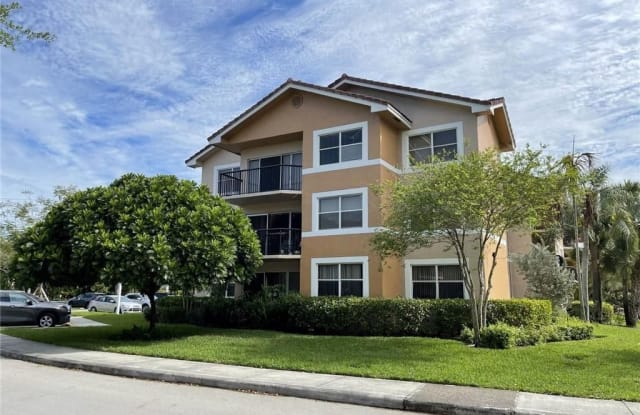 8901 Wiles Rd - 8901 Wiles Road, Coral Springs, FL 33067