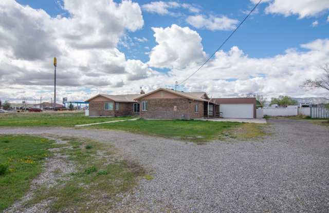 Spacious 3 Bed 2 Bath Brick Home with RV Parking, Shop Space & Large Yard in Tremonton! photos photos