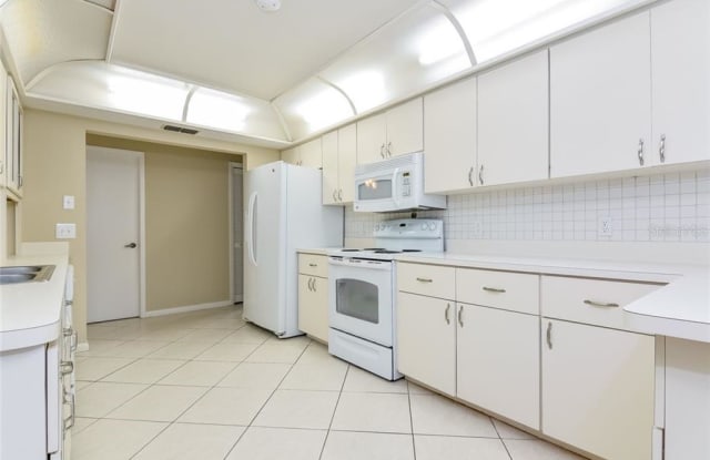 1751 PEBBLE HILL COURT - 1751 Pebble Hill Court, Palm Harbor, FL 34683