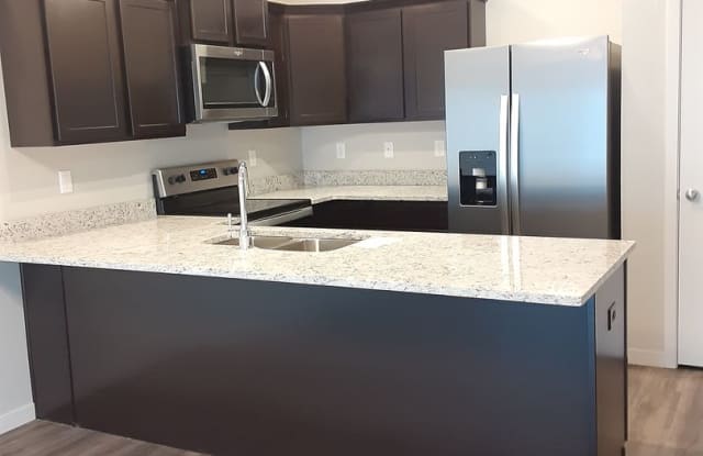 Modern Living in a 3-Bed, 2-Bath Townhome with Attached 2 Car Garage - 613 Liberty Park Drive, Box Elder, SD 57719