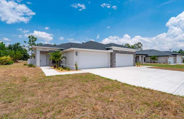 NEW Villa-duplex home with quartz counters, 2-car garage, and a rear patio photos photos