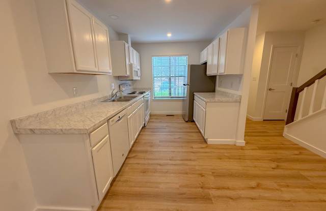 Welcome to this beautifully updated 2-bedroom, 2.5-bath lakeside condo in the highly sought-after Oaks of Avent Ferry community. photos photos
