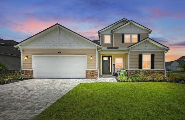 Stunning 5-bedroom, 4-bathroom home with a private office and spacious loft, situated on a premium corner lot with lawn care included - 24 Tradesman Lane, St Johns, FL 32259