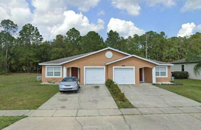 Welcome to Your New Home in Serene Wedgefield, FL - 20715 Macon Parkway, Wedgefield, FL 32833