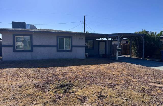 Colorful bungalow style home with plenty of yard. photos photos