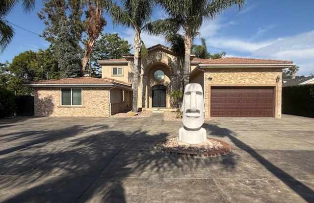 Gated estate with a backyard oasis photos photos