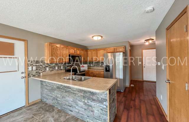 Charming 3-bedroom, 3-bath home with a fenced backyard and a partially finished basement. Gallery 3