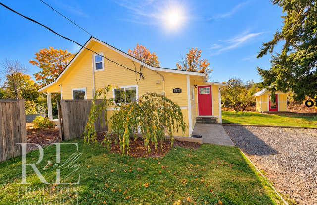 Whimsical Craftsman with Wraparound Porch, Bonus Room & Liberty Bay Peek Views Gallery 1