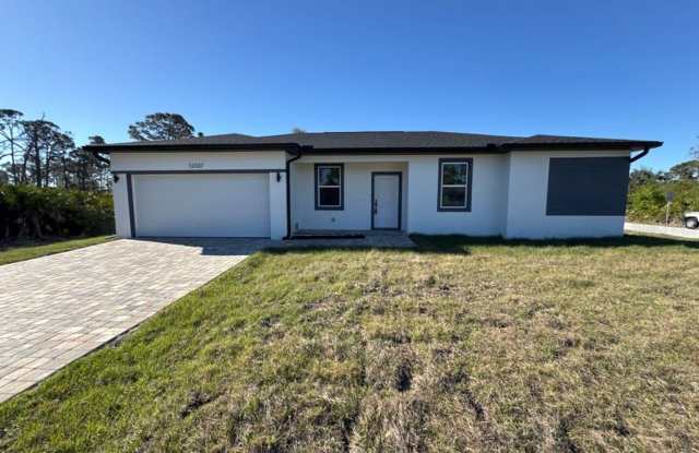 This immaculate, newly built 4-bed, 2-bath home in Port Charlotte is move-in ready or perfect for renting out! - 12337 Gulfstream Boulevard, Charlotte County, FL 33981