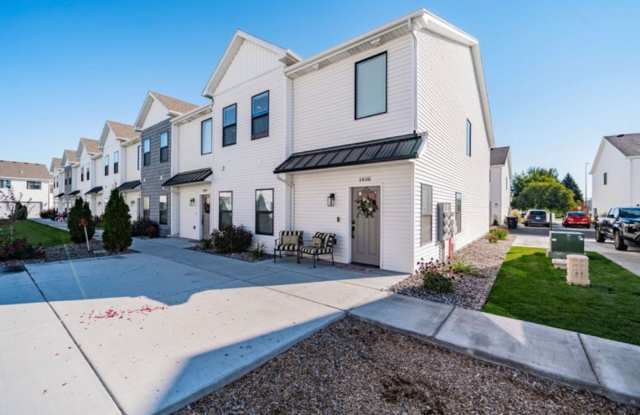 AWESOME END UNIT with attached 2 stall garage and additional personal parking spot on the exterior photos photos