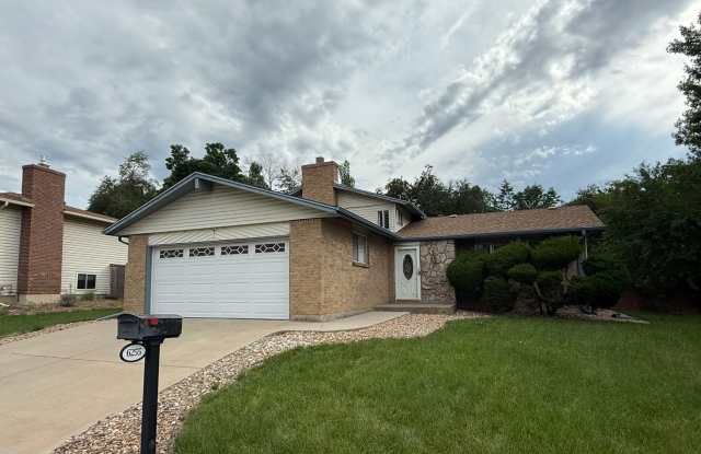 Spacious Tri-Level Home Featuring 4BD/2.5BA in Quiet Centennial Neighborhood. Updated Kitchen and Laminate Flooring! Large, Private Backyard! photos photos