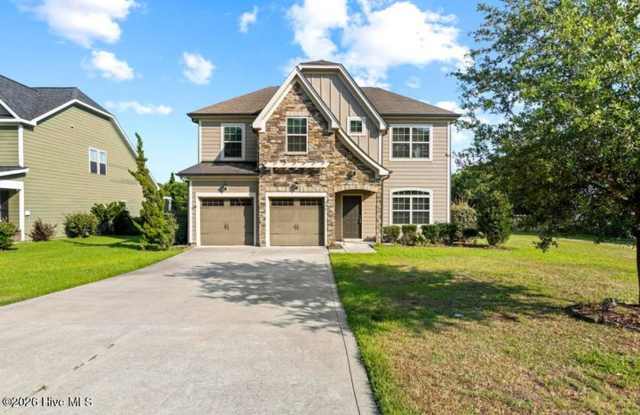 Set along a peaceful pond in the gated community of Mimosa Bay Gallery 1