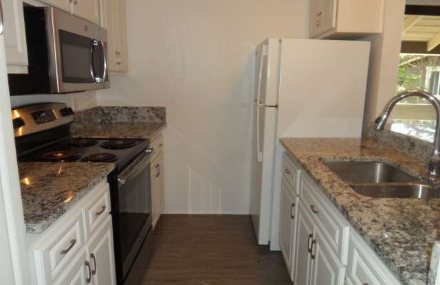 Bright Second Story Studio 1 Bath 1 Parking Carport with on site EV charging Station Gallery 1