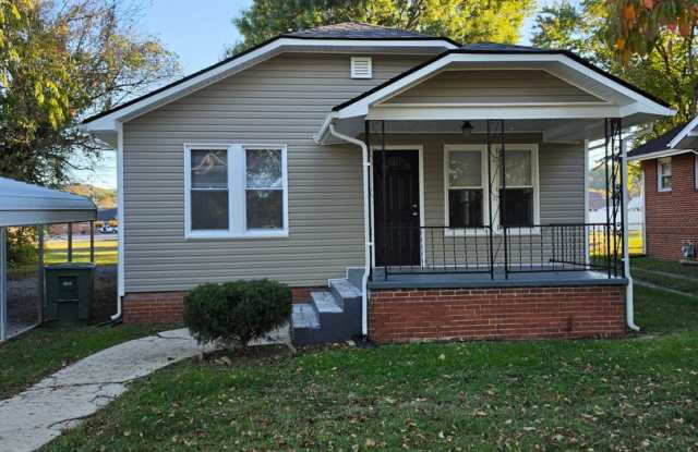 Renovated 2/1 colonial style cottage on quiet street with large laundry room, cellar, and carport. Gallery 1