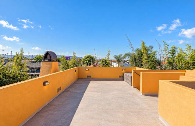 SPACIOUS & SECLUDED, SPANISH MEDITERRANEAN REAR UNIT TOWNHOUSE W/ LARGE ROOFTOP DECK W/ OCEAN/PV VIEWS, 2 BALCONIES, WRAP AROUND YARD & 2-CAR GARAGE ON CUL-DE-SAC STREET CLOSE TO SCHOOLS, SHOPPING, RB PIER & BEACH! Gallery 4