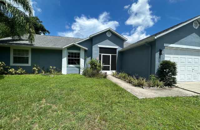 Beautiful Stucco Home in the Heart of Palm Bay! Interior is Newly Renovated with a Modern Farmhouse look!! photos photos