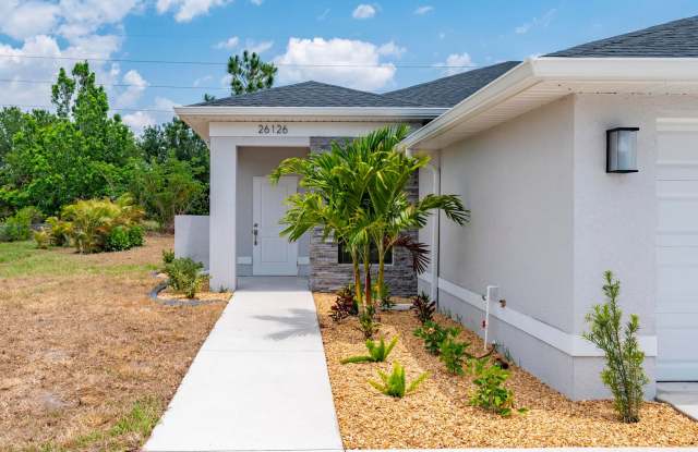 NEW Villa-duplex home with quartz counters, 2-car garage, and a rear patio photos photos
