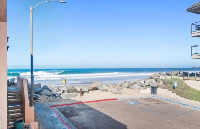 Coastal Living at Its Best – Beautiful Townhome with Ocean Views, Just Steps from the Beach! Gallery 1