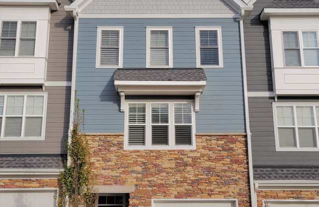 Stunning 4 bedroom 3.5 bath townhome located in Bedford Falls at Hickory Grove. photos photos