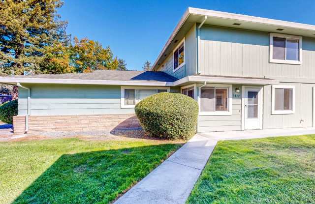 Lovely Two Bedroom One Bath Two Story Condo with Carport & Laundry Facility Gallery 1