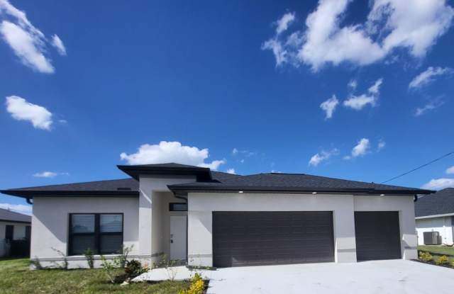 Brand-New Luxury Home with 3-Car Garage & Lawn Care Included | Modern Living in Cape Coral! photos photos