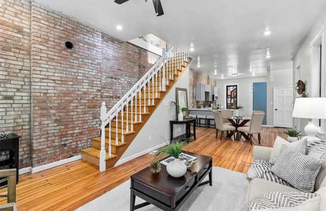 Exposed Brick Charm | Spacious 2-Bed, 2-Bath with Open-Concept Living photos photos