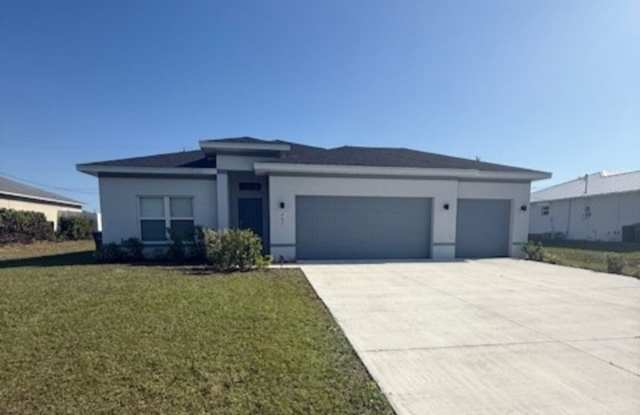 Spacious 4-Bedroom Home with 3-Car Garage in Cape Coral – Model Home Available! photos photos