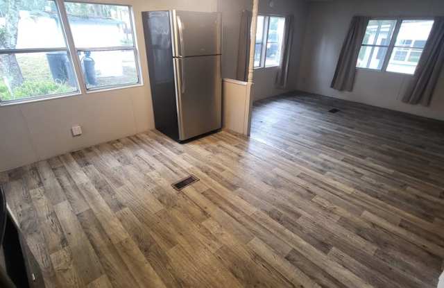 Freshly painted spacious 2-bedroom 1-bath home with a screened porch and storage shed. Gallery 4