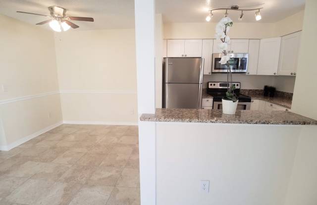 Beautiful Remodeled First Floor 2/2 Condo x Rent in front of Full Sail. photos photos
