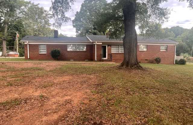 This Beautiful 4 bed 2.5 bath brick ranch home sits on 0.68 acres of land in the desired Steelberry community Gallery 1