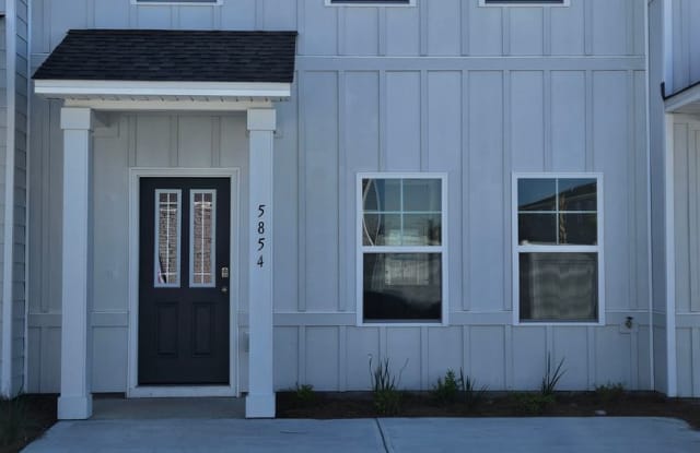 Discover Modern Living at Tyndall Station: Brand-New 3Bed/3Bath Townhome! **SPECIAL: 1/2 Off First Month's Rent for Lease by 05/31/25!** photos photos