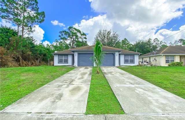3/2 Duplex with 1 Car Garage - 611 Hawthorne Avenue South, Lehigh Acres, FL 33974