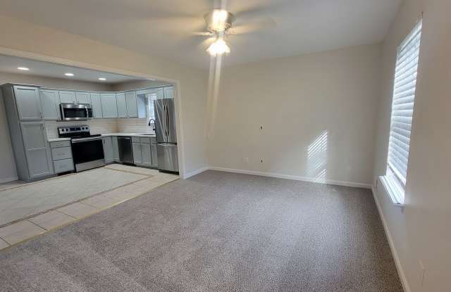 Stunning Open-Concept 3BR Home with Fenced Backyard & Off-Street Parking Gallery 3
