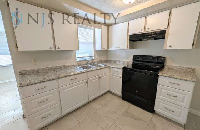 NEW renovation 2 bed/1 bath ~NEW: tile floors, kitchen renovation & paint! with a HUGE fenced yard!! Gallery 3