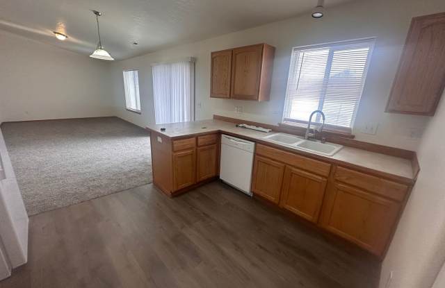 MOVE IN SPECIAL! New Carpet, flooring  paint! 3 Bedroom 2 Bath with 2 car attached garage. - 7820 Three Rivers Drive, Pasco, WA 99301