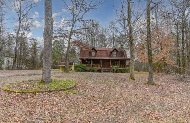 Charming Log Cabin on a Large Wooded Lot – A Rare Find in Lexington! photos photos