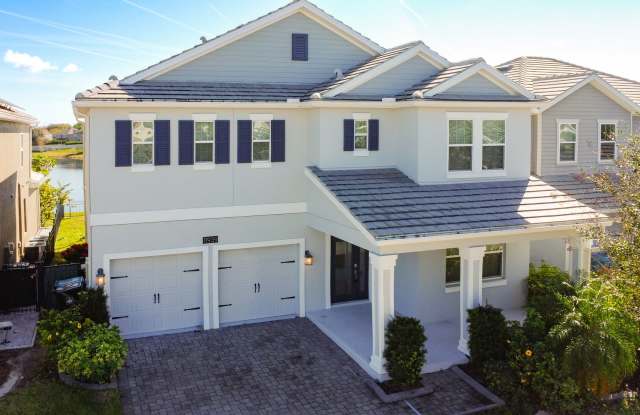 4 Bedroom 2.5 bath LUXURY Lake Nona Storey Park Pool Home with Solar Panels and a Pond View! photos photos