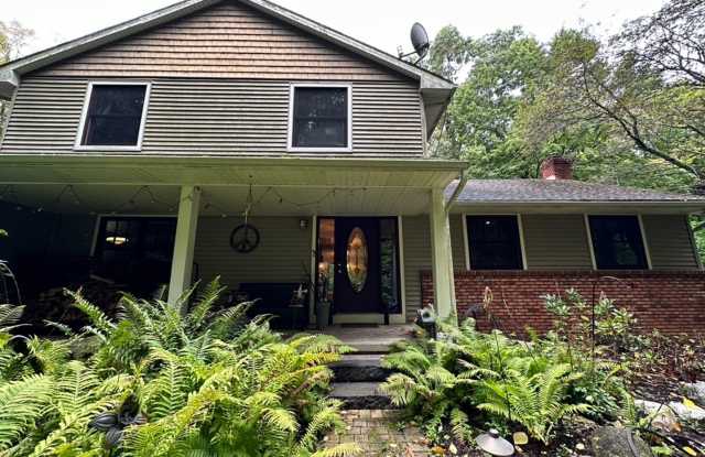 Dream Home in Highland, Michigan: Your Private Oasis on 5 Wooded Acres photos photos