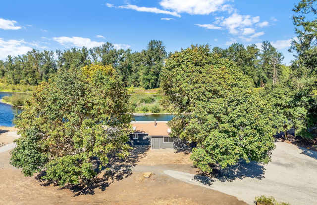 RARE RIVERFRONT HOME WITH LARGE SHOP ON ACREAGE!! Gallery 4