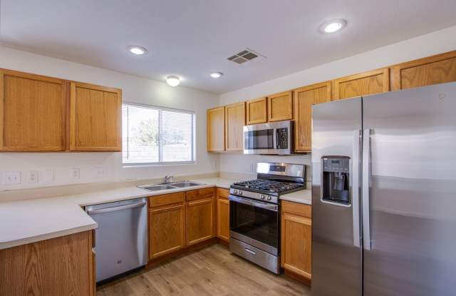 Lovely 4 bedroom 2.5 bath townhome in North Las Vegas gated community with a pool! photos photos