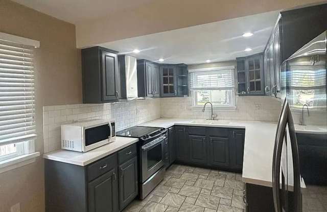 Close to Campus! 4BR Home with Finished Basement, Private Parking & Hardwood Floors photos photos