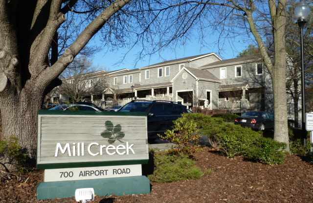 Walk to Campus from this spacious, updated 4br 2ba townhome-style condo! Gallery 1