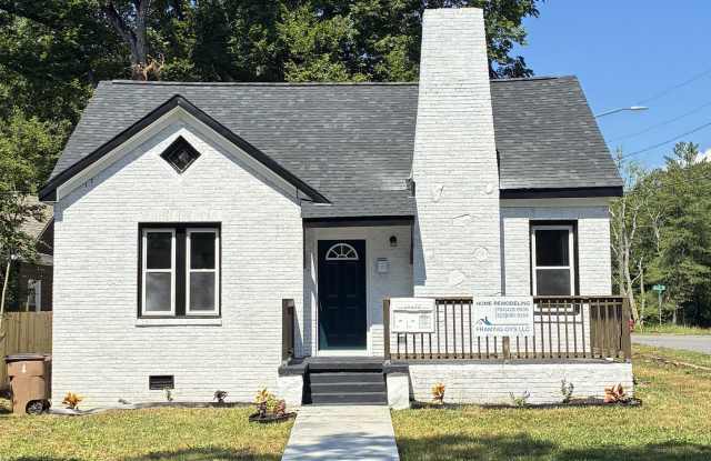MOVE-IN READY NOW! This timeless beauty with great bones has been RENOVATED FROM TOP to BOTTOM! Gallery 1