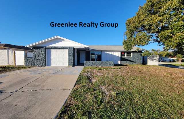 Spacious, stylish, and move-in ready—your perfect 4 Bed/ 2 Bath Port Richey home awaits! photos photos