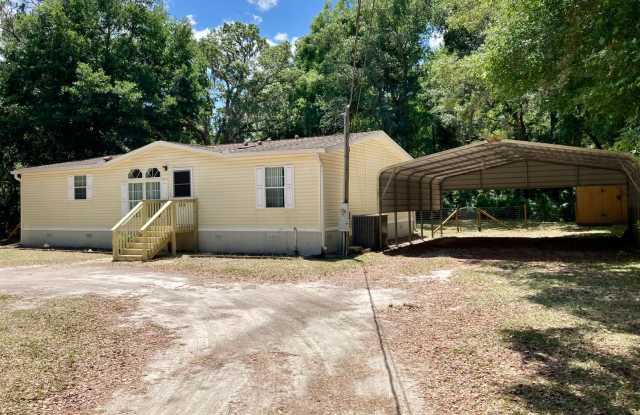 Available Soon! 3 bedroom, 2 bath home with carport and shed! photos photos